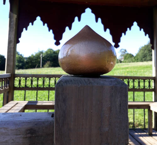 Tew Timber Buildings - Finishing Touches. Indian gazebo turned wooden onion painted gold.
